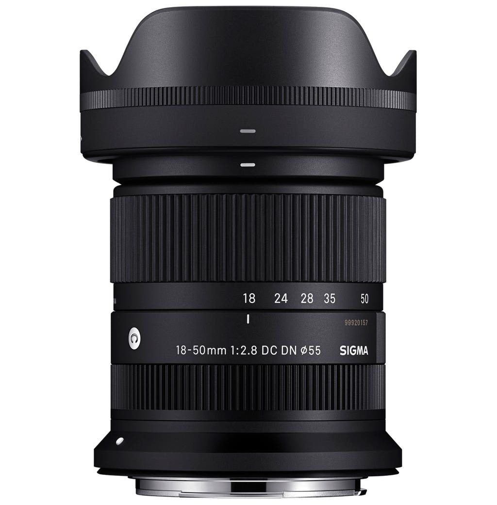 Sigma 18-50mm camera lens in black, angled front view with zoom ring details