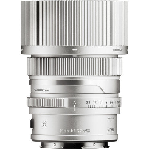 Sigma 50mm f/2 DG C camera lens, silver barrel with engraved aperture markings