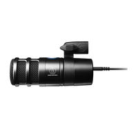 USB podcast microphone with black grille and silver body, side view