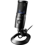 Black USB condenser microphone on round desk stand, angled view
