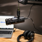 Audio-Technica AT2040USB microphone on desk stand with USB cable