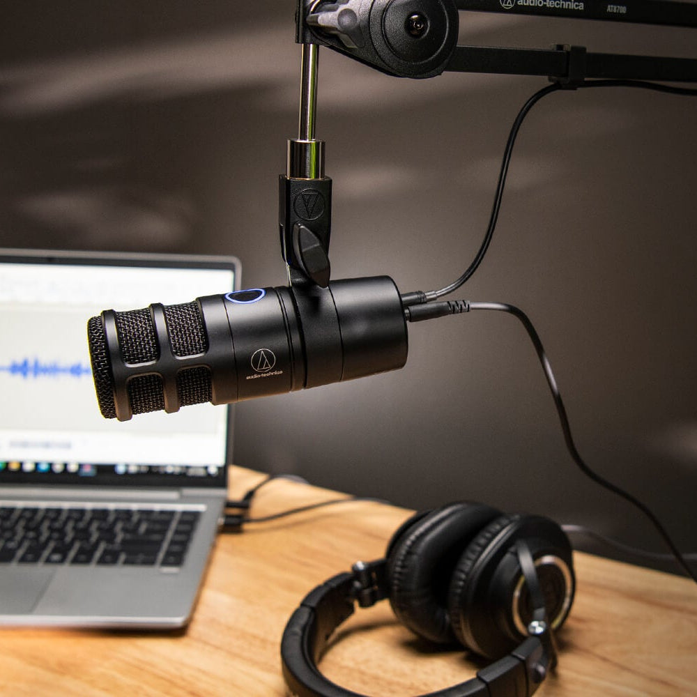 Audio-Technica AT2040USB microphone on desk stand with USB cable