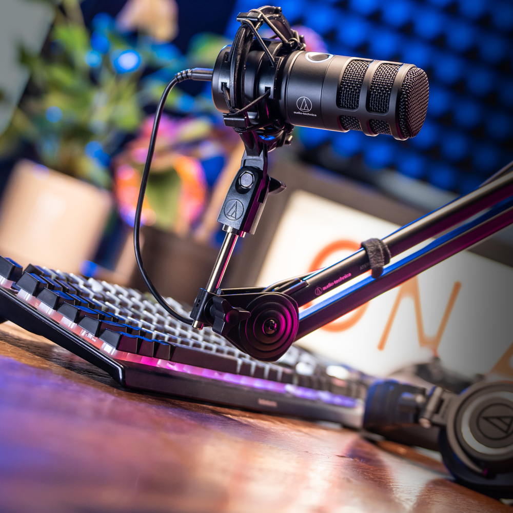 Audio-Technica AT2040USB microphone on boom arm with connected cable