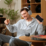 Wireless clip-on microphone system on a man using a phone for audio capture