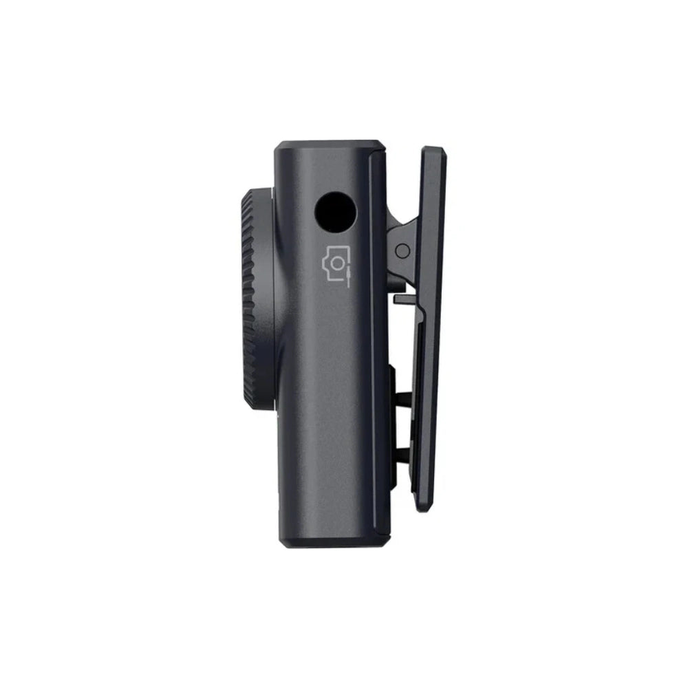 Wireless audio transmitter body with clip and ports, dark charcoal gray