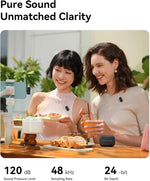 Wireless mic clip-on transmitters with small receiver, shown during conversation at table