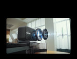 Black streaming transmitter on desk mount with glowing blue indicator ring