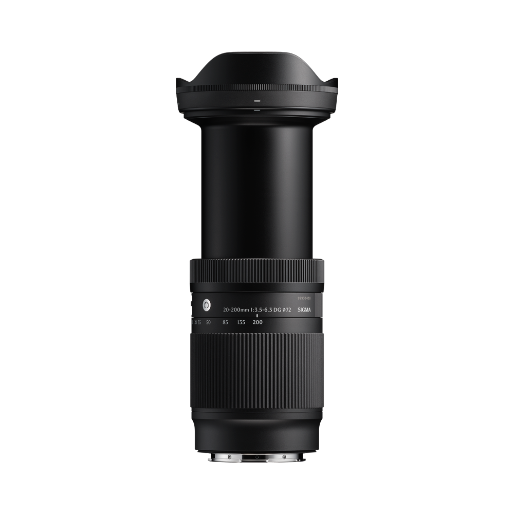 Telephoto zoom camera lens viewed from the side, showing engraved scale markings