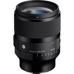 Black camera lens front with glass element and aperture scale markings