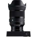 Black camera lens with front element, ribbed focus ring, and mount controls
