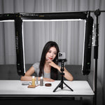 Portable black air tube light with tube bars on a tripod stand