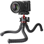 Octopus tripod holding a camera with cold shoe mount and flexible legs
