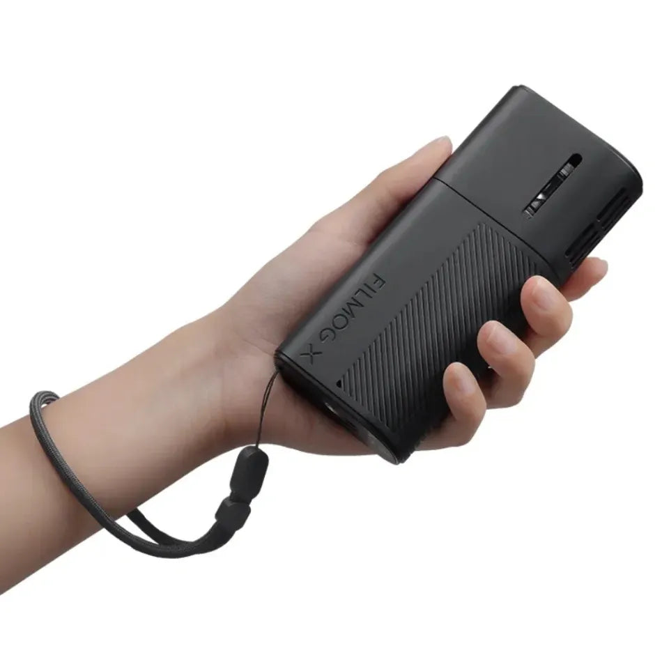 Hand holding a black power bank with 'Ulanzi FM02 FILMOG X Fog Machine' branding on a white background