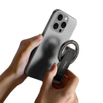 Phone tripod clamp attachment with magnet-style ring and hands holding smartphone