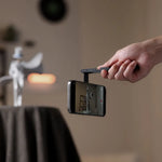 Foldable phone tripod clamp with smartphone mounted, ready to record